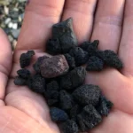 Black volcanic lapilli for flower beds and garden features, 10-20 mm, 20 litre bag.