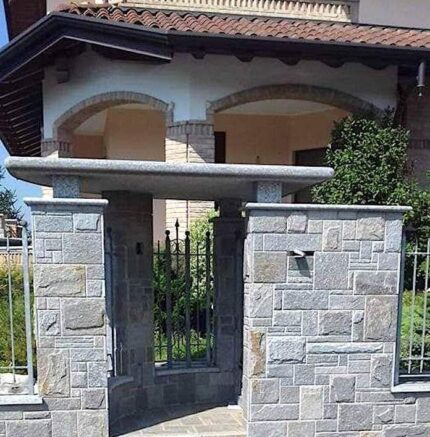 &ldquo;Luserna Scozzese&rdquo; stone cladding, mixed sizes, sawn sides, rock-faced finish.